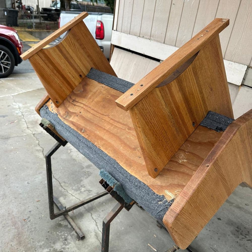 A restored church pew, hand-finished by the Pew Re-Up Crew family workshop
